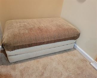 A wonderful ottoman, that opens for storage.