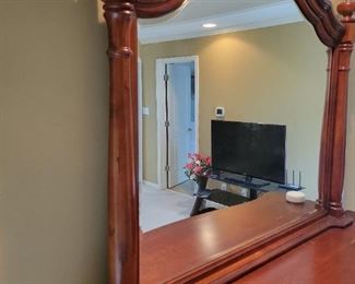 A solid wood bedroom set. Queen bed and bench as well as a high-boy dresser and long dresser with nightstands