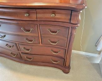 A solid wood bedroom set. Queen bed and bench as well as a high-boy dresser and long dresser with nightstands