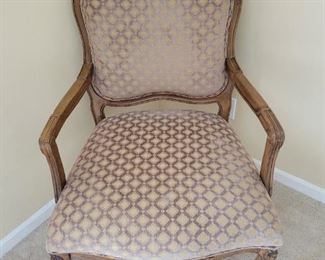 Decorative vintage wood and upholstered accent chair.