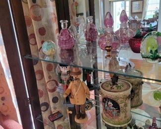 West German Nutcracker, German Hand Carved wood smoking man, Gingerbread cookie tin, German canister, Hungarian mini painting, Elwood hand-blown glass and Egyptian perfume bottle