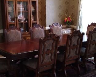 Very ornate and Beautiful dining set purchased at Nebraska Furniture Mart 6 chairs and 2 Captain's chairs. Has 2 leaf extensions in making this table 8 ft 10" L x 44"  *each leaf is 18" x 44"