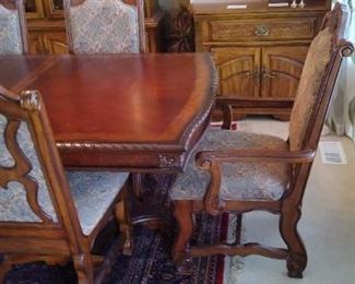 Very ornate and Beautiful dining set purchased at Nebraska Furniture Mart 6 chairs and 2 Captains chairs