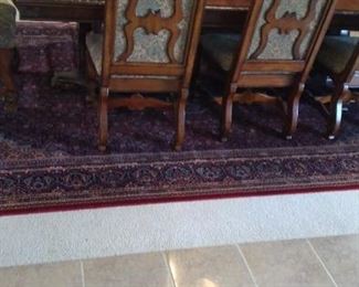 Hand woven Danish rug and Very ornate and Beautiful dining set purchased at Nebraska Furniture Mart 6 chairs and 2 Captains chairs
