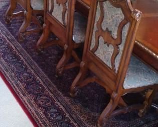 Hand woven Danish rug and Very ornate and Beautiful dining set purchased at Nebraska Furniture Mart 6 chairs and 2 Captains chairs