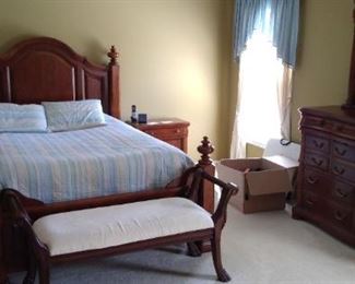 A solid wood bedroom set. Queen bed and bench as well as a high-boy dresser and long dresser with nightstands. Bed head board 67 1/2" H x 66 1/2" W; base board 37" H x 66 1/2" W.  Night stands 28" W x 16" D x 28" H