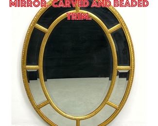 Lot 256 Gilt Wood Framed Oval Mirror. Carved and beaded trim. 