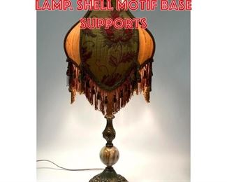 Lot 303 Decorative Metal Table Lamp. Shell motif base supports 