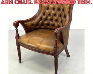 Lot 382 Tufted Leather Vintage Arm Chair. Brass studded trim. 