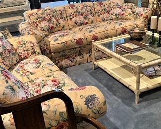 Floral sofa and loveseat; bamboo style glass-top coffee table