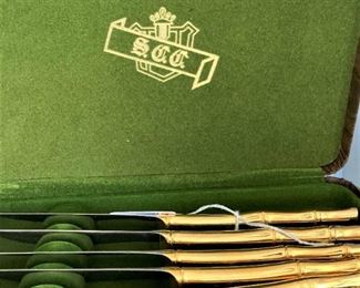 Set of gold-toned fruit knives