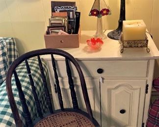 Child's antique chair; white side table; Tiffany style table lamp