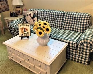 Forest green and white sofa; white coffee table with great storage