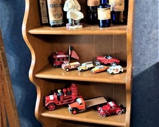 Maple book case; vintage metal trucks; old medical bottles