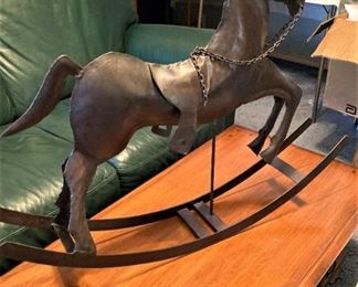 Metal rocking horse (green leather sofa - NOT available)