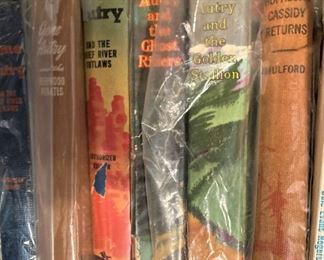 Old books (individually wrapped in plastic) including Gene Autry books