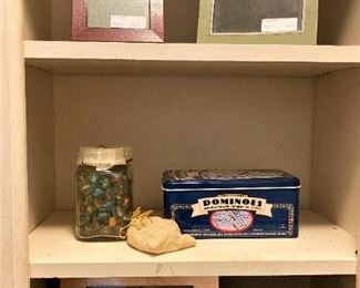 Frames; jar of marbles; dominoes