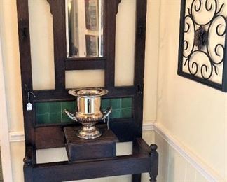 Antique hall tree with mirror and dark green tile