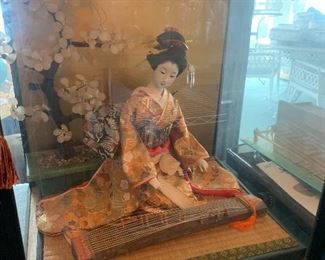 1971 Koto Doll with musical instrument on Tatami Mat base in glass case Overall dimensions 18" h x 16" w x 14" d 