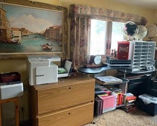 Office filled with equipment, furniture, file cabinets, globes etc...