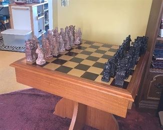 AMAZING Mid Century Hand Carved Soapstone Chess Set. Each piece is 2 lbs. Teak Game Table with felt lined compartmentalized drawers. Mint condition! Table: 29"h x  34"w x 34"l   Chessmen are 7"h x 2 1/4" w