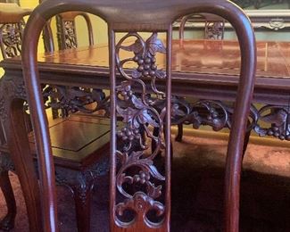 1978 Carved Rosewood Dining Room Table with two 18" leaves, 8 Carved Matching Chairs with custom cushions & table top mats. Purchased and delivered directly from Hong Kong in '78