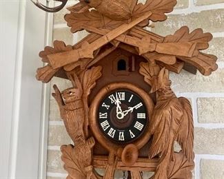 Cuckoo clock with deer buck carving
