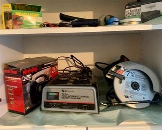 Many Cabinets in garage loaded with all types of tools 