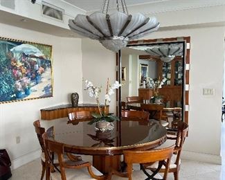 Gorgeous round table with a leaf and 6 arm chairs by Designed by Enrique Garcel handmade in Columbia for "Today's Custom Design" marked $2500.  I believe the mirror is also from them marked $2500.  The Art Deco Style Chandelier is unsigned and is approximately 4 feet in Diameter by about 16" in depth of glass marked $3,500. 