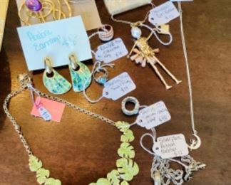 Lot of unique costume jewelry, including sterling Disney Tinkerbell necklace. 