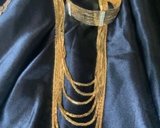 Norman Miller multi-strand serpentine necklace, $30, bracelet, $18