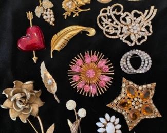 Brooch price list

Top left, then clockwise: 
Crystal Heart, $18
Leaf w/ stones $6
Rose w/ pearls $10
Small fancy leaf $6
Open work floral scroll $18
Triple ring rhinestone $6
Kenneth J Lane Star w/ amber stones $45
BSK white Flower $20
Crown Trifari rose $24
Avon red heart w/ arrow $28
Pearl grapes $18
Bird on nest $16
Avon reversible oval $16
Judy Lee atomic burst gold & pink $30
Gold feather $8
Milk Glass oval $10
Two small flowers $18
Leaf & pearl $10