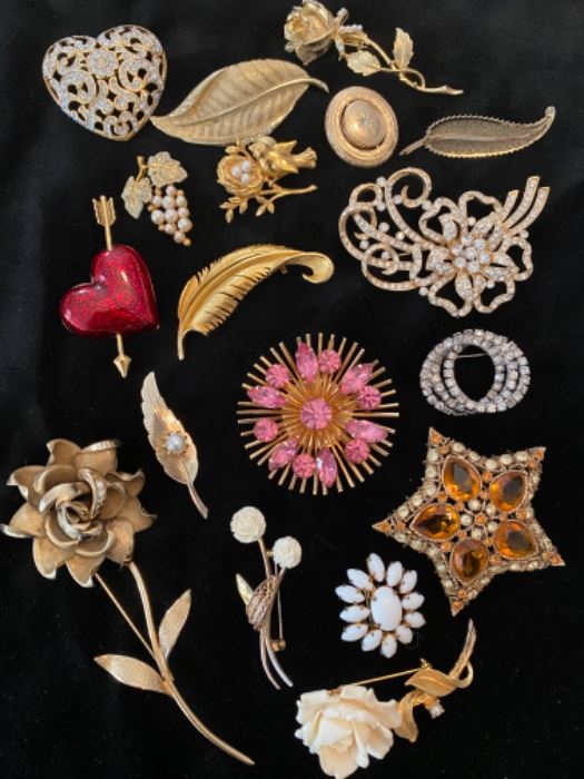 Brooch price list

Top left, then clockwise: 
Crystal Heart, $18
Leaf w/ stones $6
Rose w/ pearls $10
Small fancy leaf $6
Open work floral scroll $18
Triple ring rhinestone $6
Kenneth J Lane Star w/ amber stones $45
BSK white Flower $20
Crown Trifari rose $24
Avon red heart w/ arrow $28
Pearl grapes $18
Bird on nest $16
Avon reversible oval $16
Judy Lee atomic burst gold & pink $30
Gold feather $8
Milk Glass oval $10
Two small flowers $18
Leaf & pearl $10