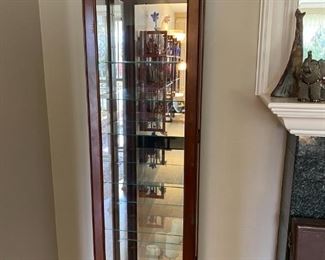 Like new slim mirrored and lighted glass display case