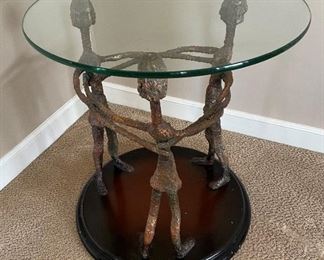 Glass top table on sculpture like base