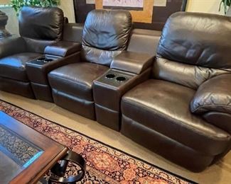 Theater style seating powered reclining chairs and cup holders, sold as a set of three