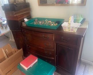 Classic sideboard, full of flatware and linens $250