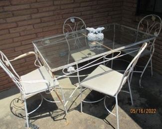 Glass top, wrought iron table and chair set