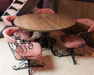Vintage wrought iron table and 4 swivel chairs