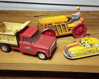 Vintage Structo dump truck, Mark tin tractor and Marx Skyview Yellow Cab