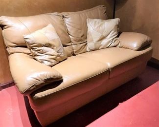 Tan leather loveseat