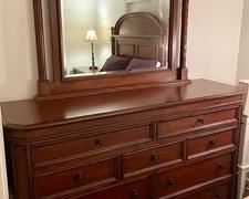 Delightful Dresser with Mirror. You will have plenty of room to store your clothing in this very stylish dresser.Measures 67x45x20 inches and the mirror measures 41x50 inches. 