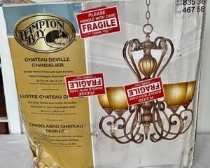 Hampton Bay "Chateau Deville" Chandelier measures 24x26 inches. This item is new in the box.  Need some new beautiful lighting in your home, this is the perfect lot for you! 