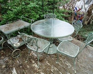 a beautiful Woodard table, chairs and serving cart