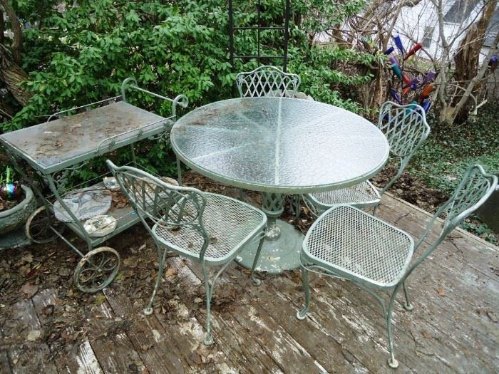 a beautiful Woodard table, chairs and serving cart