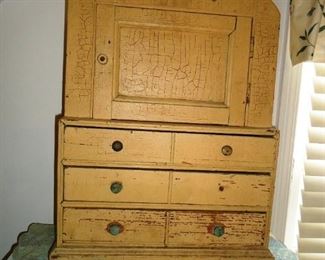 this is an antique mini doll/toy dresser