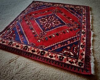 small square Persian rug