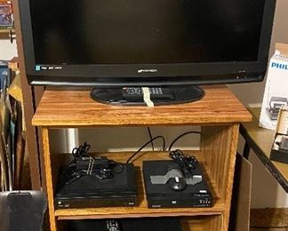 Emerson HDMI 32in Flat Screen TV; TV Stand; Toshiba VCR/DVD DVR670 (there are 3 of these); Magnavox DVD Player
