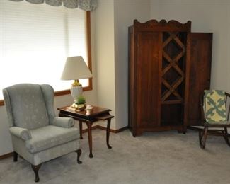  Wingback chair (40” high, 28” wide, 33” deep), Queen Anne Georgian style tea tables w/pull out trays, two available (28”x18”), antique armoire w/wine cabinet (76” tall, 38” wide, 16.75” deep), quilt over antique oak rocking chair.