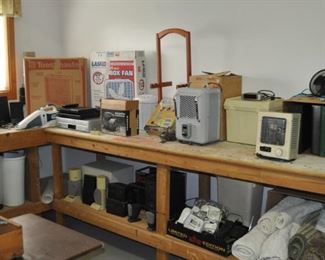 One of three available work benches, heater, DVD player, fans, miscellaneous.